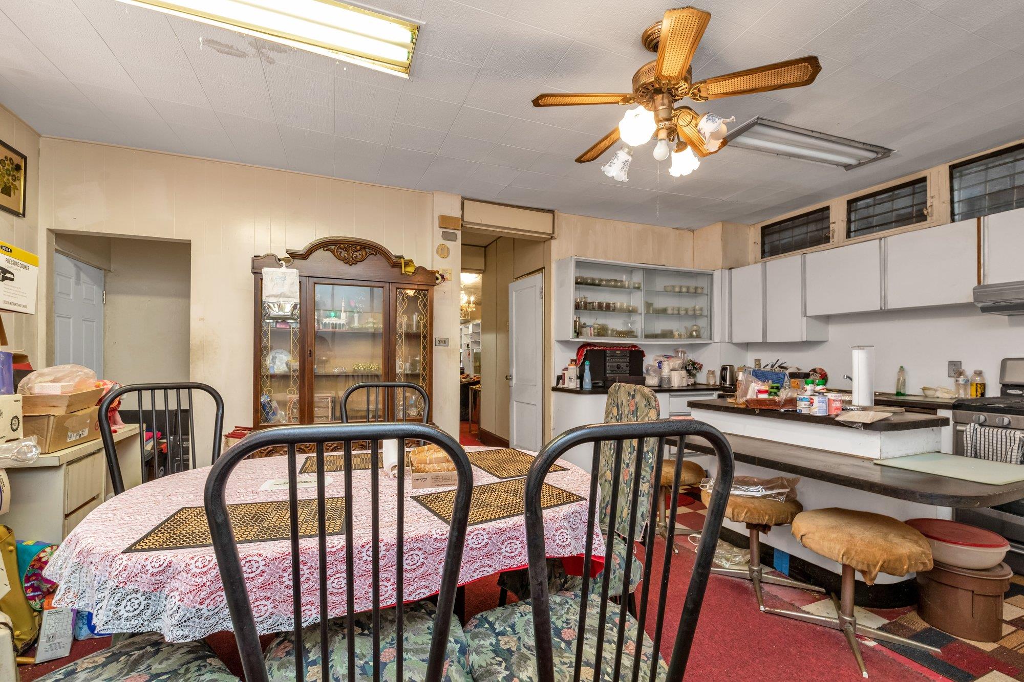 112-50 38th Avenue Queens, NY 11368 - Photo 10 of 17 a very nice looking dining room with furniture chandelier and a window