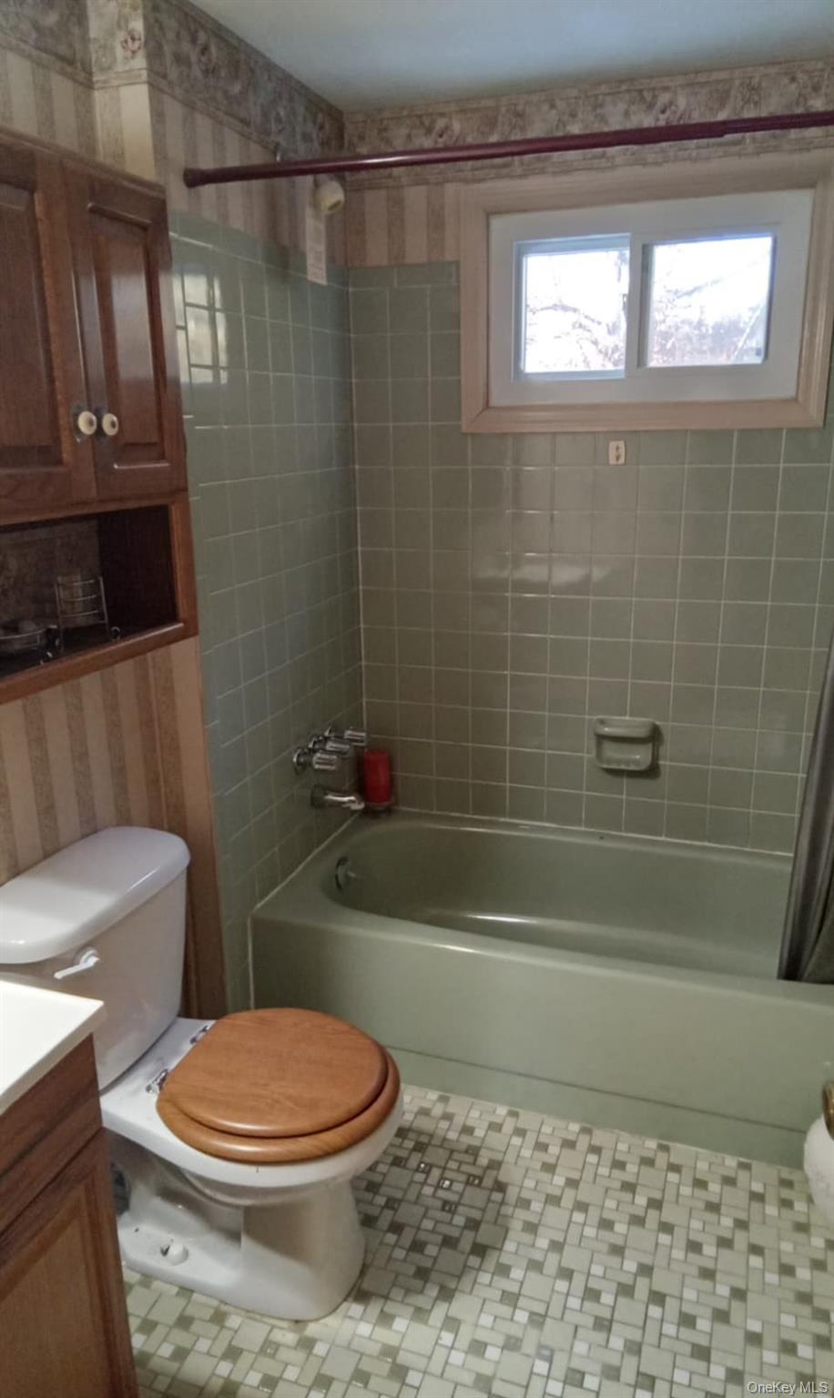 88 Barnes Road Blooming Grove, NY 10992 - Photo 6 of 12 Bathroom fully tiled shower / bath combo, vanity, and light tile patterned floors