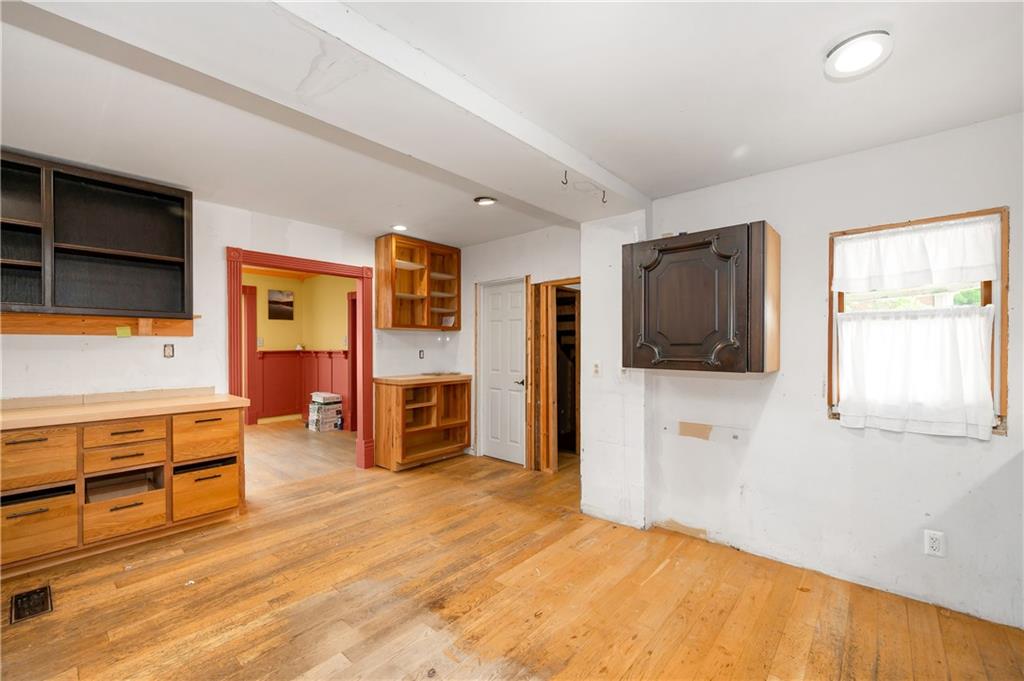 438 Main Street Prospect, PA 16052 - Photo 15 of 46 a living room with furniture a flat screen tv and kitchen view