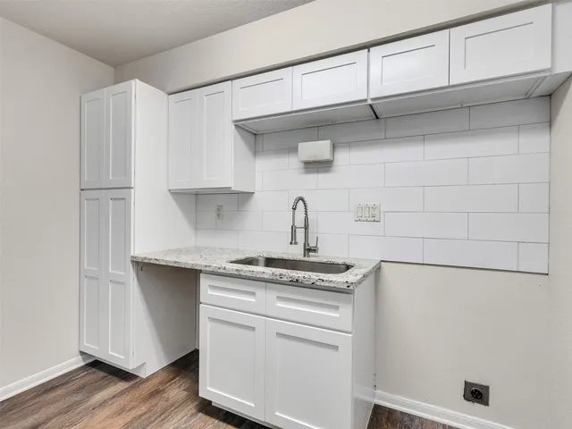 a kitchen with stainless steel appliances a stove and cabinets