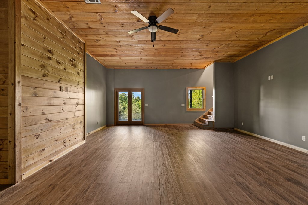 479 Big Timber Road Mineral Bluff, GA 30559 - Photo 33 of 60 wooden floor in an empty room with a window
