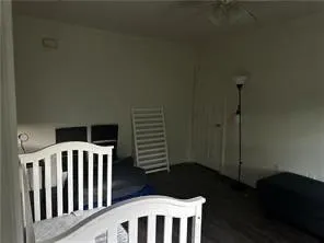 a view of wooden floor and windows in a room