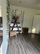 a view of livingroom and hardwood floor