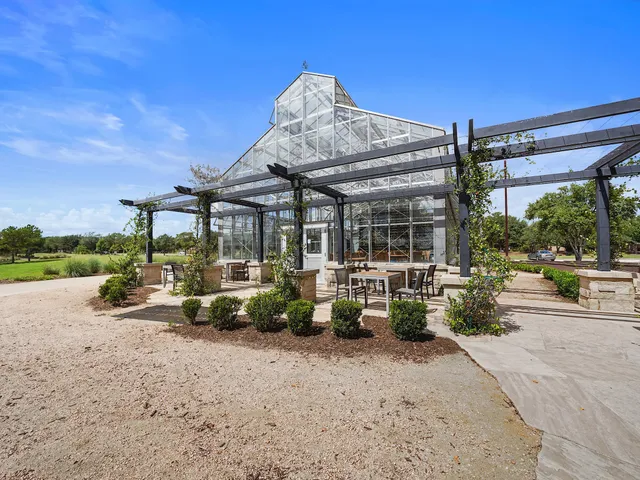 a view of a house with sitting area and roof