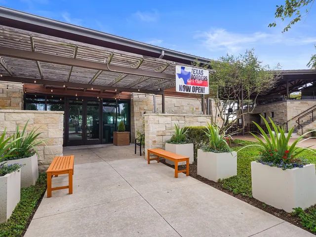 a outdoor living space with furniture and a potted plant