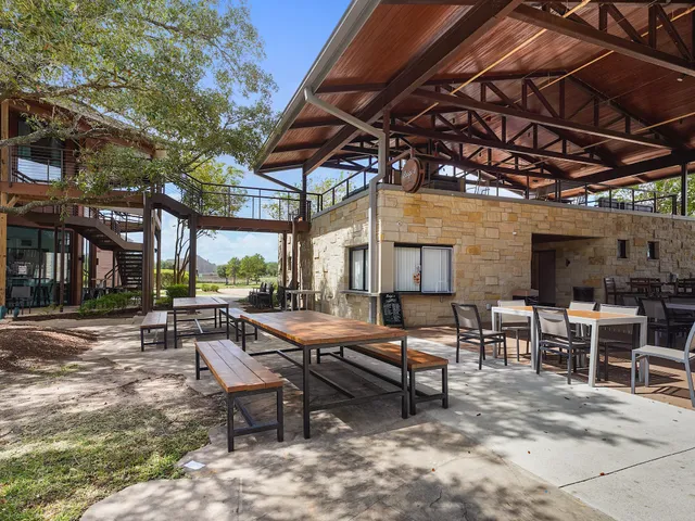a view of a dinning table and chairs in the patio