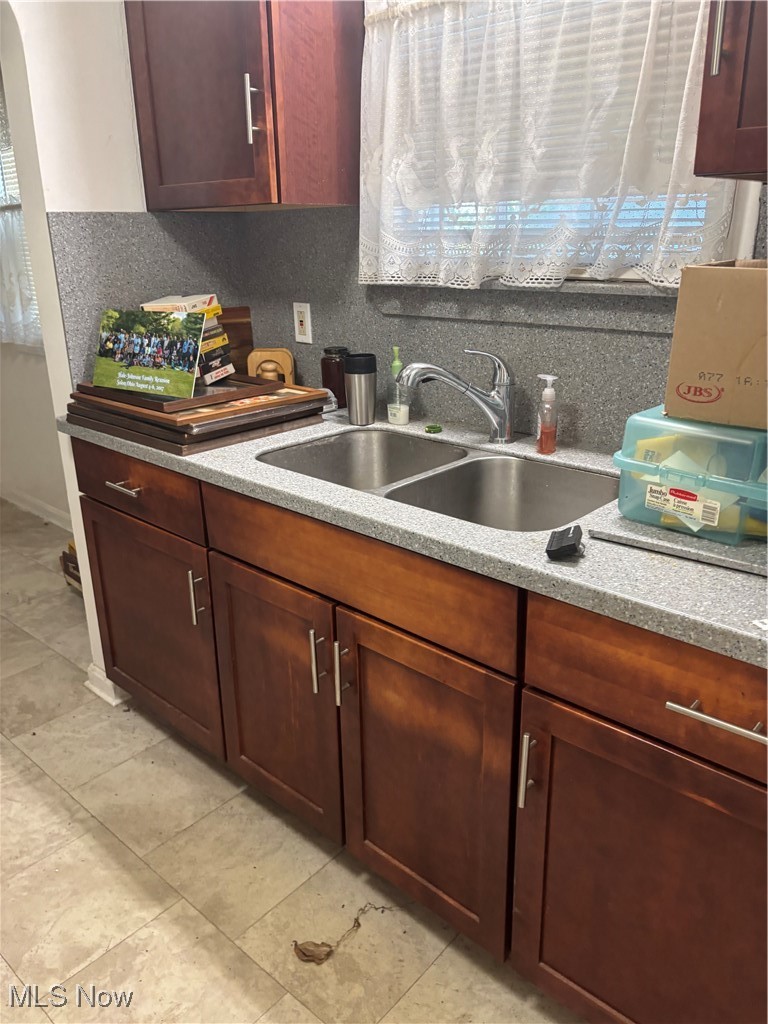 986 Woodview Road Cleveland, OH 44121 - Photo 2 of 9 Kitchen featuring light countertops and arched walkways