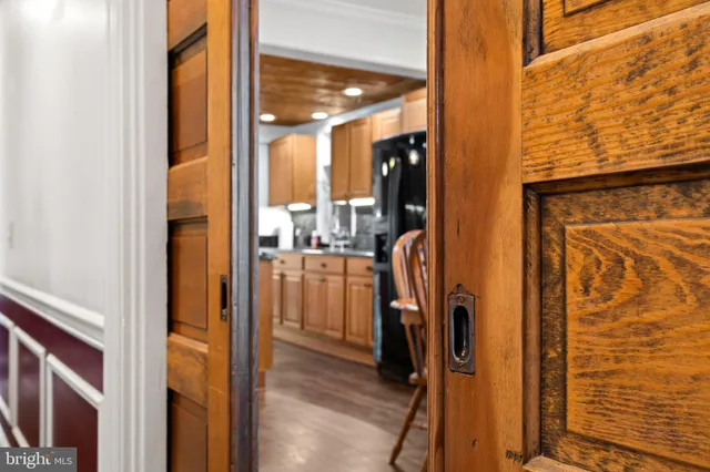 a view of an entryway with wooden floor and staircase