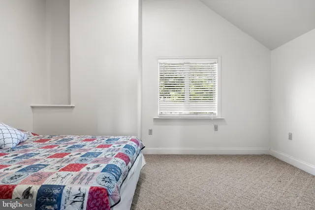 a bathroom with a toilet sink and shower curtain