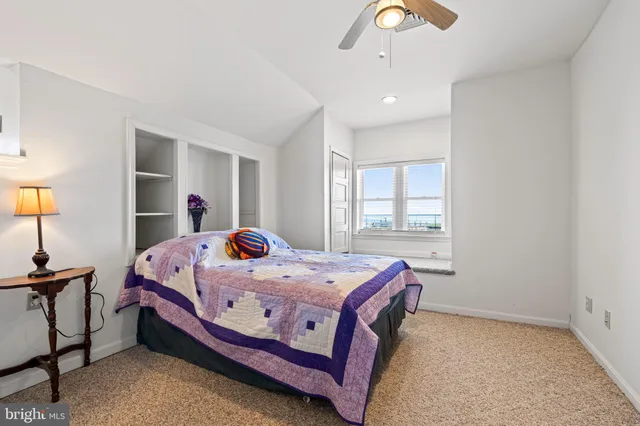 a bedroom with bed and a window