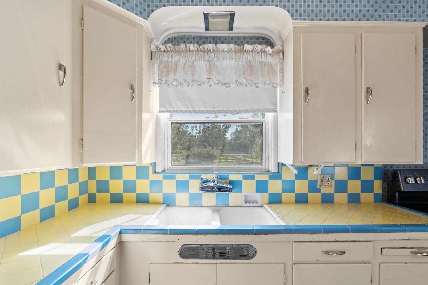 3058 7th Avenue Hanford, CA 93230 - Photo 11 of 38 a view of kitchen with granite countertop window