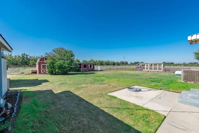 a view of a garden and basketball court