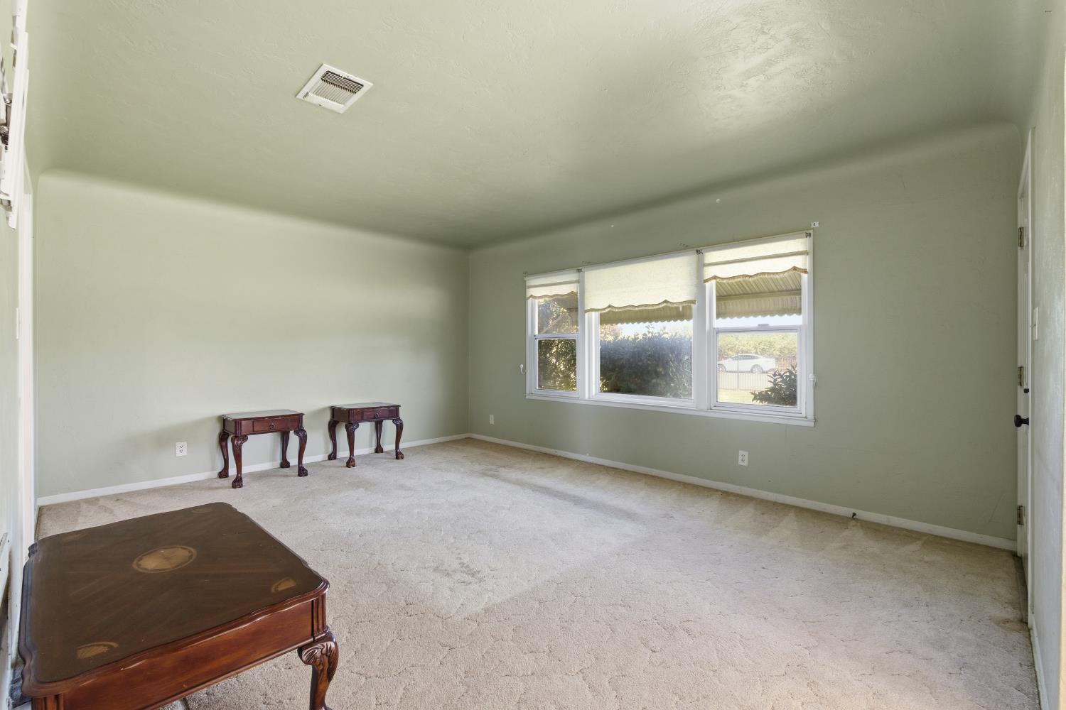 3058 7th Avenue Hanford, CA 93230 - Photo 5 of 38 an empty room with windows