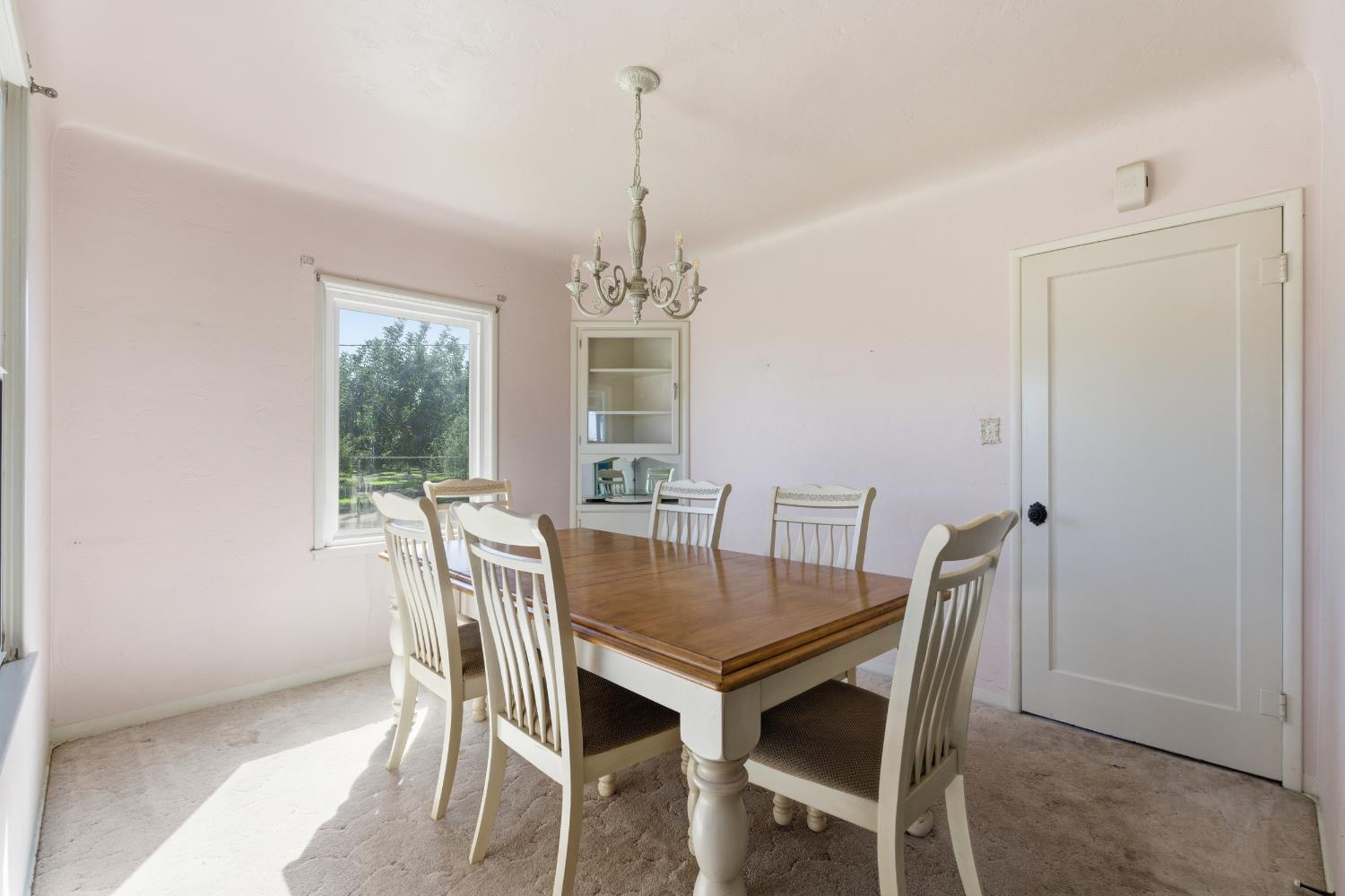 3058 7th Avenue Hanford, CA 93230 - Photo 7 of 38 a view of a dining room with furniture window and wooden floor