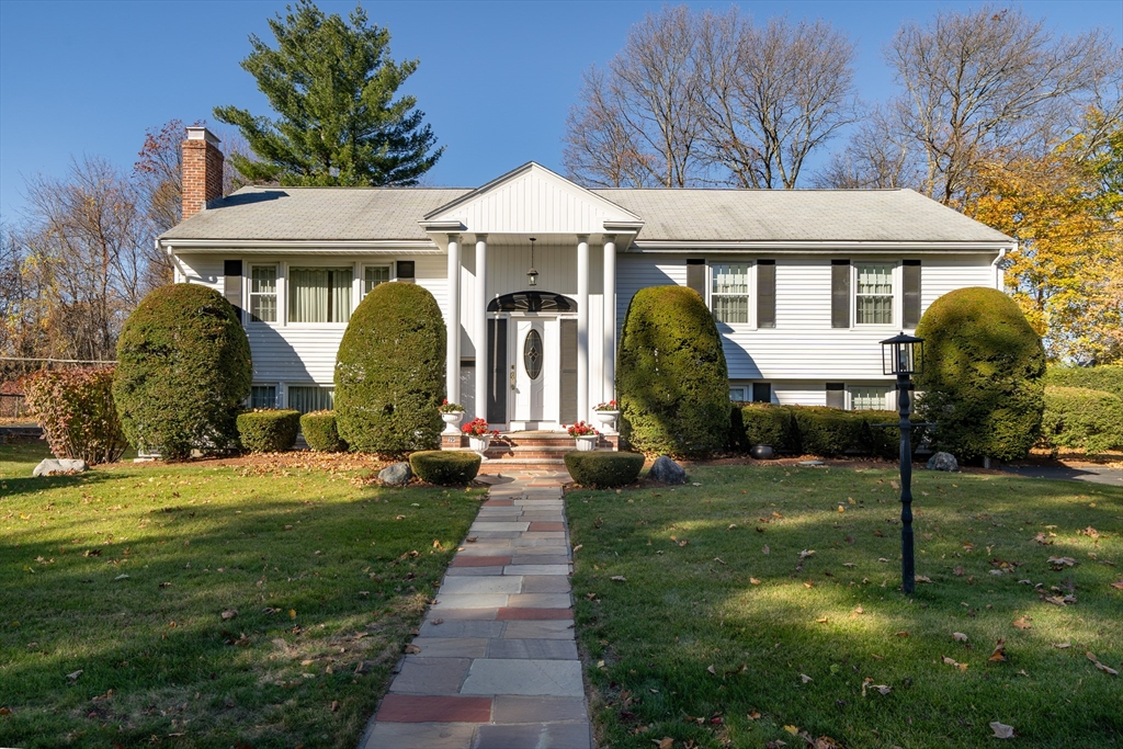 19 Phinney Road Lexington, MA 02421 - Photo 1 of 42 a front view of a house with garden