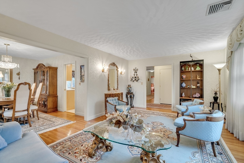 19 Phinney Road Lexington, MA 02421 - Photo 17 of 42 a living room with furniture a rug and white walls