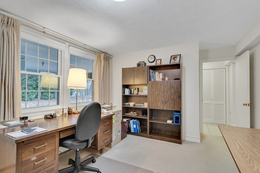 19 Phinney Road Lexington, MA 02421 - Photo 31 of 42 a view of a workspace with furniture and a window