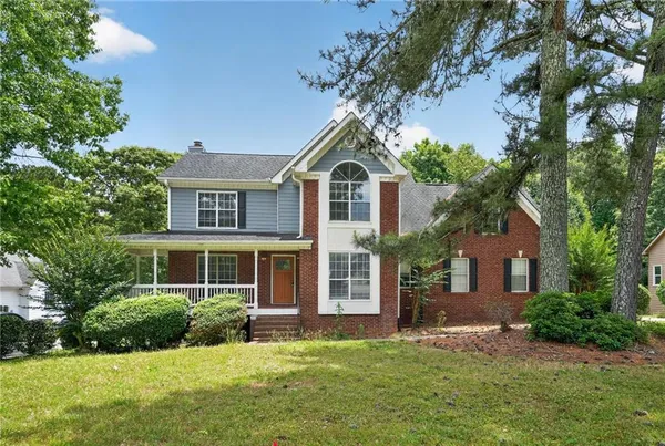 front view of a house with a yard