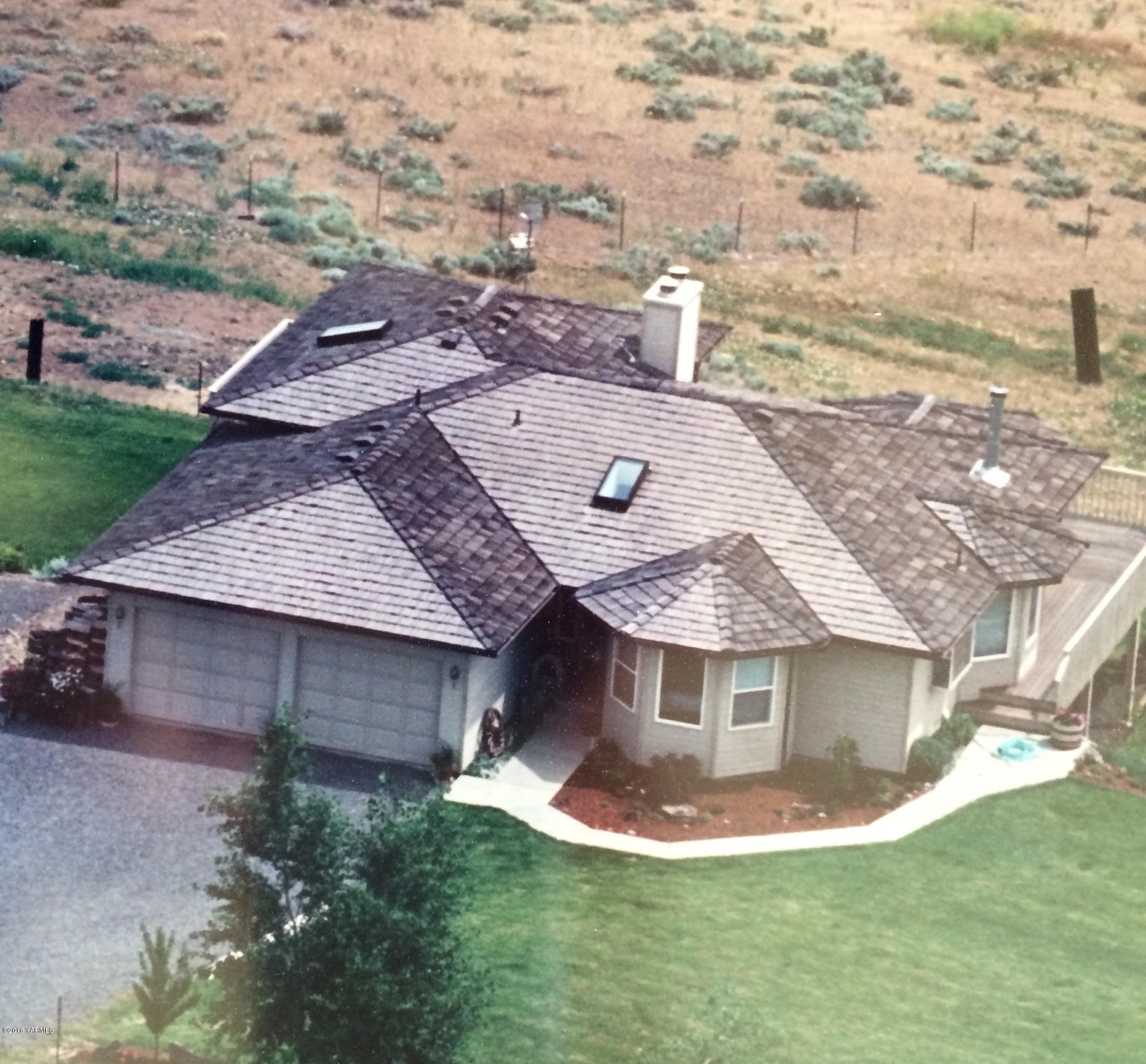 13910 Fisk Road Yakima, WA 98908 - Photo 2 of 48 a aerial view of a house with a yard