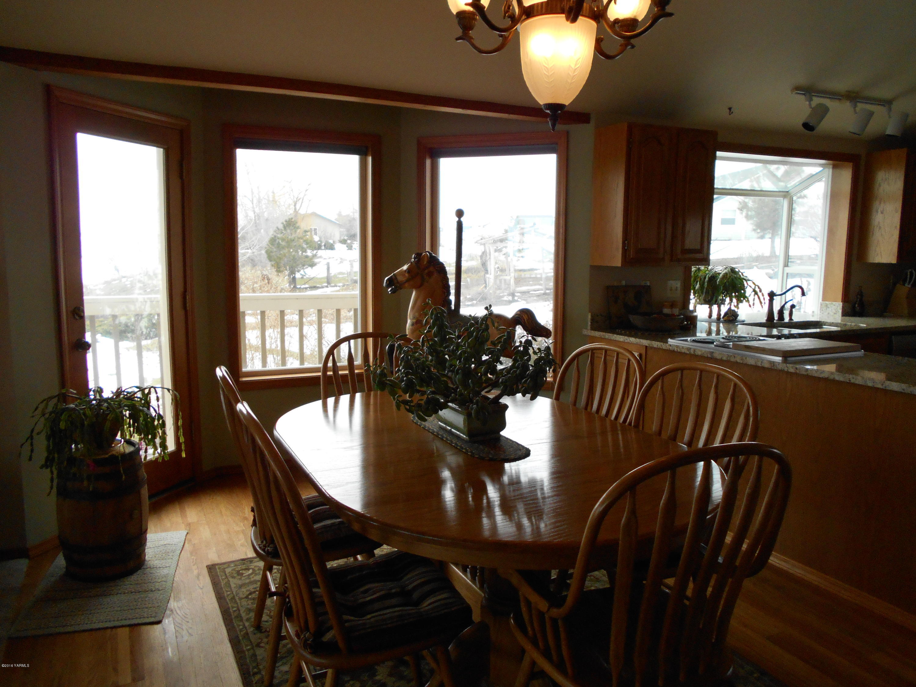 13910 Fisk Road Yakima, WA 98908 - Photo 20 of 48 a view of a dining room with furniture window and outside view