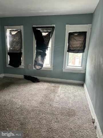 a big room with closet and windows