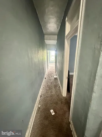 a view of an empty room and a window