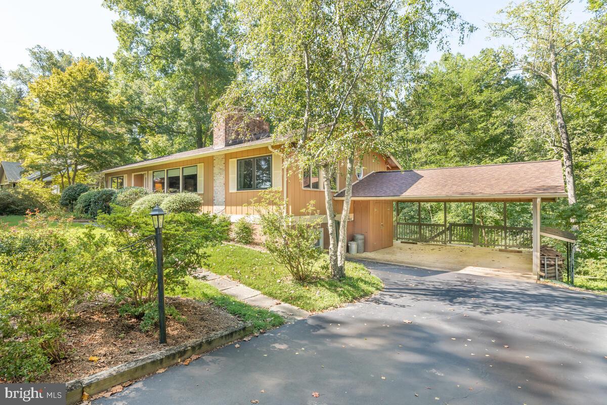 2645 Aspen Road Port Republic, MD 20676 - Photo 4 of 51 a front view of a house with yard