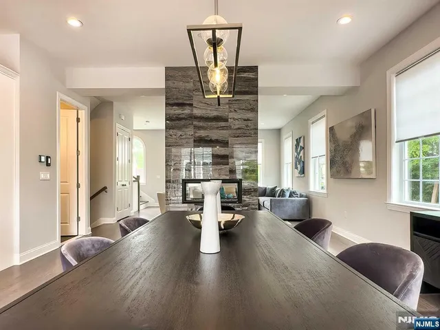 a living room with fireplace furniture and a window