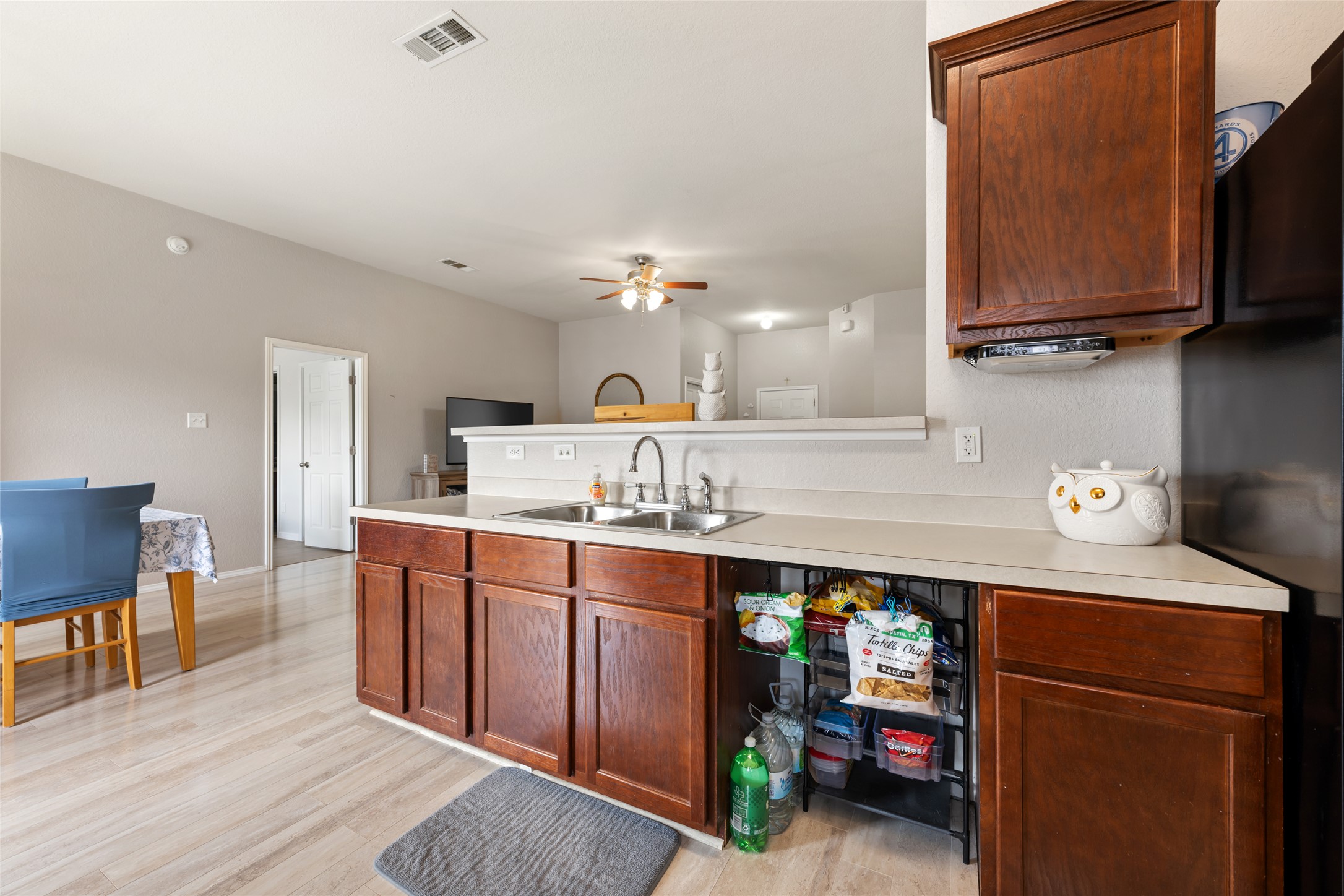 144 Calcite Lane Jarrell, TX 76537 - Photo 14 of 38 A well-equipped kitchen space featuring ample cabinetry and an integrated sink, perfect for daily living.