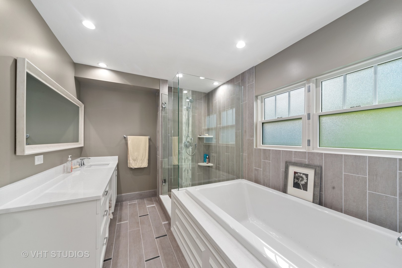 2366 Green Bay Road Highland Park, IL 60035 - Photo 23 of 37 a spacious bathroom with a double vanity sink a mirror and a shower