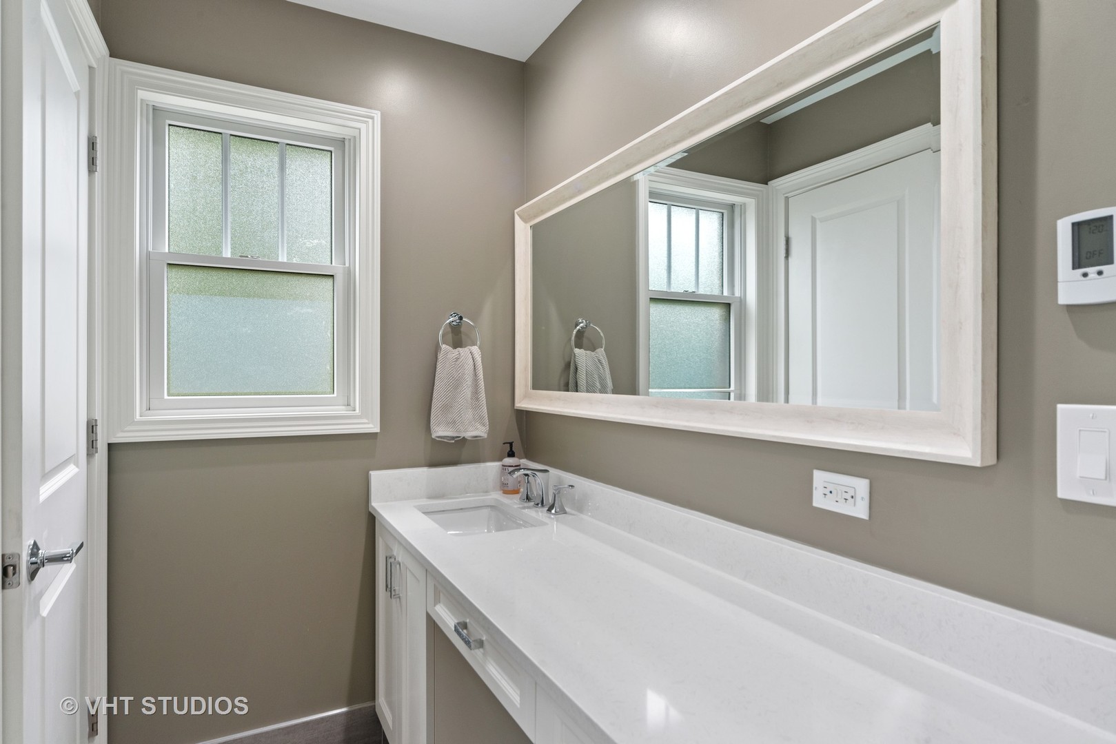2366 Green Bay Road Highland Park, IL 60035 - Photo 24 of 37 a bathroom with a sink and a mirror