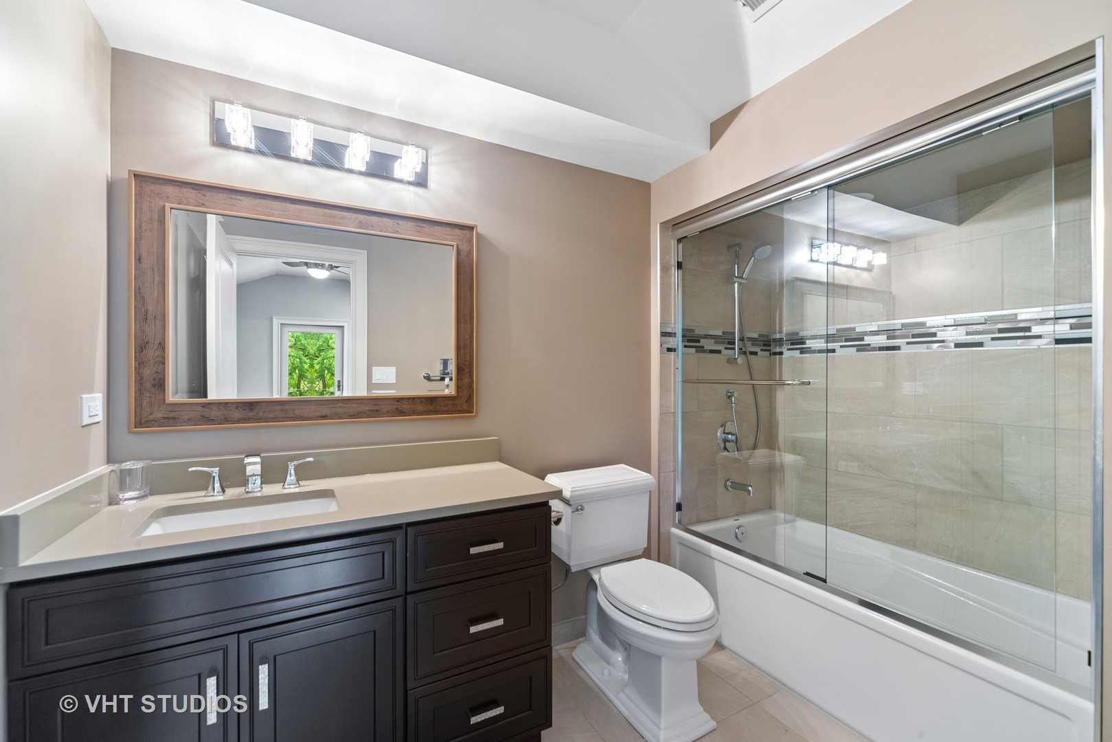 2366 Green Bay Road Highland Park, IL 60035 - Photo 27 of 37 a bathroom with a sink a toilet and shower