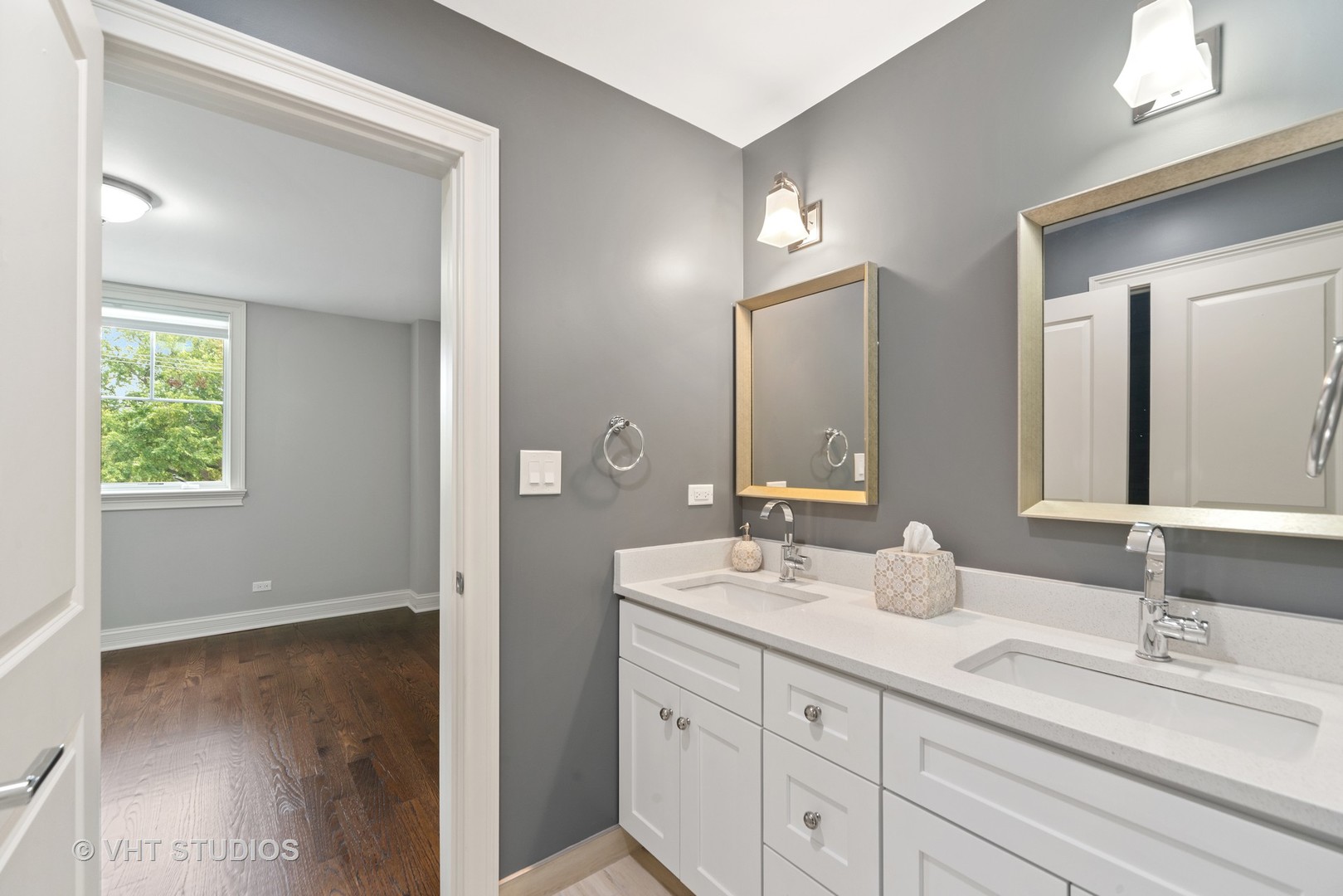 2366 Green Bay Road Highland Park, IL 60035 - Photo 28 of 37 a bathroom with a double vanity sink and a mirror