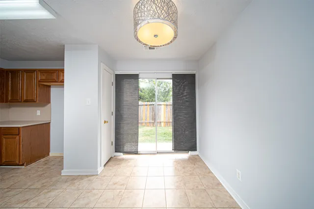 a view of a hallway with windows