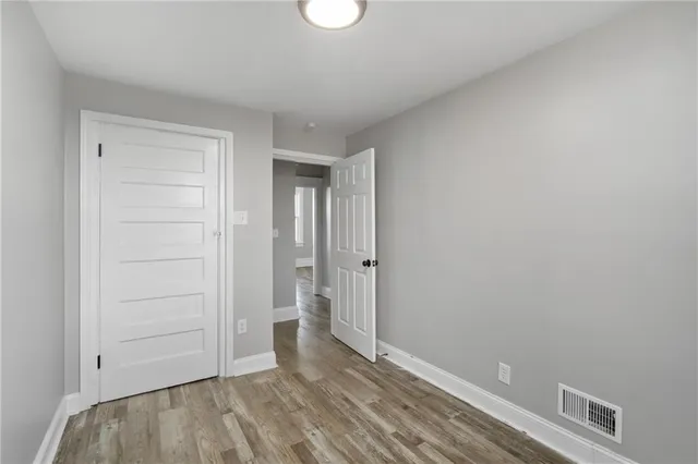 a view of room with hardwood floor
