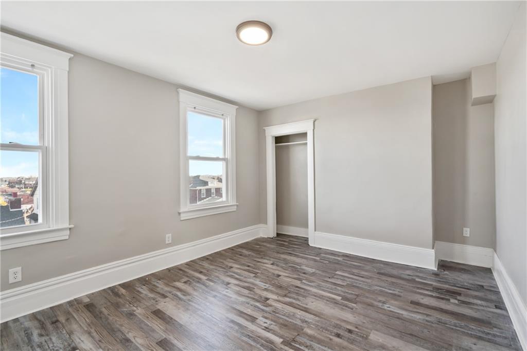 808 Bay Ridge Avenue Pittsburgh, PA 15226 - Photo 16 of 34 wooden floor in an empty room with a window