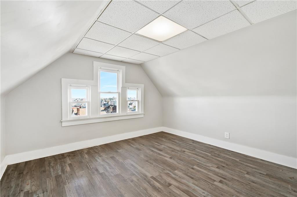 808 Bay Ridge Avenue Pittsburgh, PA 15226 - Photo 21 of 34 an empty room with wooden floor and windows