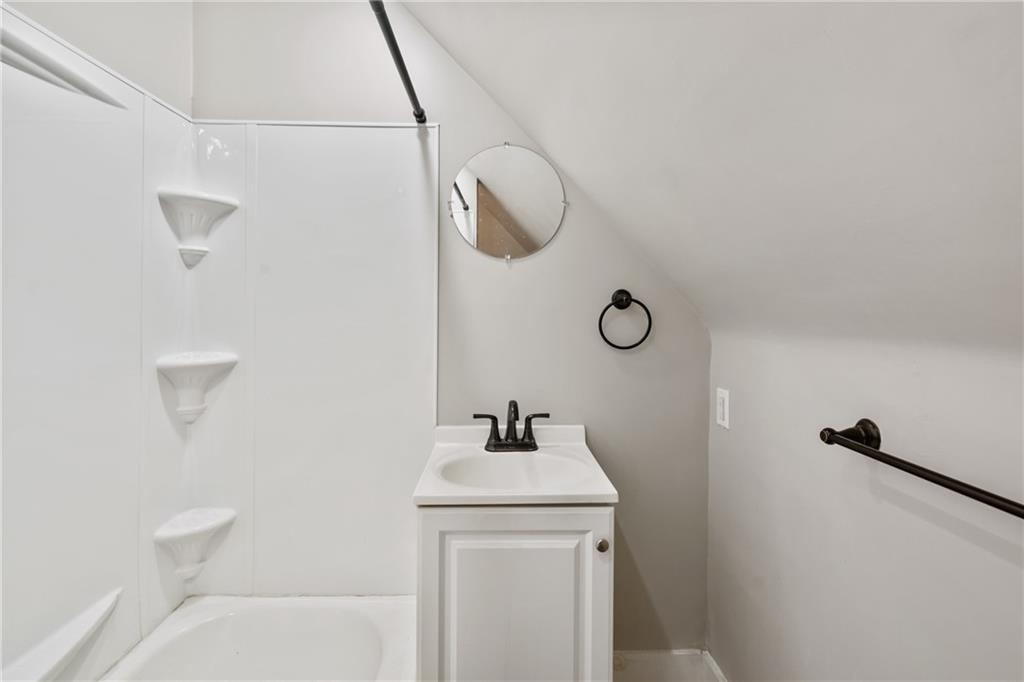 808 Bay Ridge Avenue Pittsburgh, PA 15226 - Photo 24 of 34 a bathroom with a sink and mirror