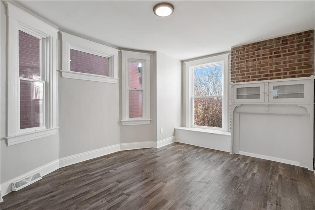 808 Bay Ridge Avenue Pittsburgh, PA 15226 - Photo 26 of 34 a view of an empty room with wooden floor and a window
