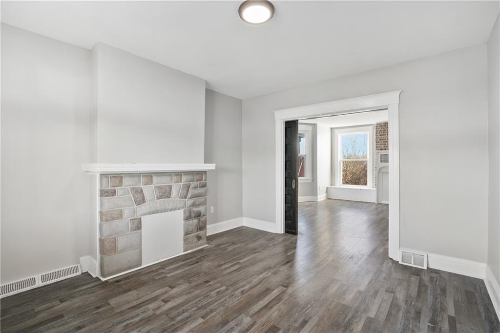 808 Bay Ridge Avenue Pittsburgh, PA 15226 - Photo 4 of 34 an empty room with wooden floor and windows