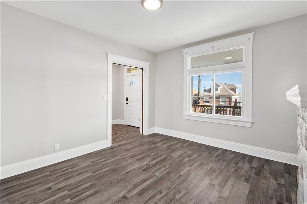 808 Bay Ridge Avenue Pittsburgh, PA 15226 - Photo 5 of 34 a view of an empty room with wooden floor and a window