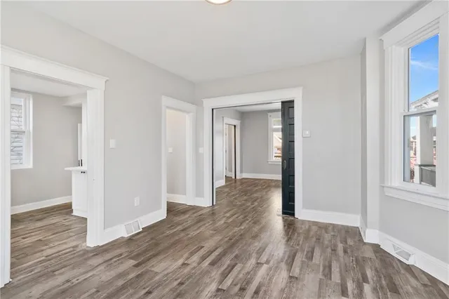 a view of hallway with wooden floor