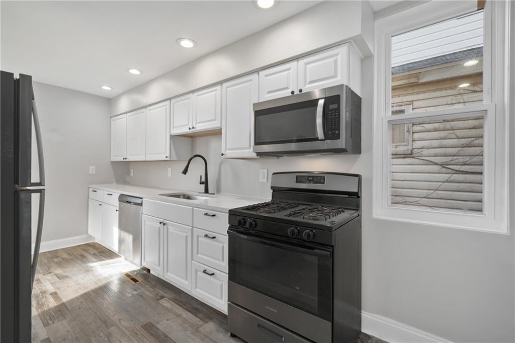 808 Bay Ridge Avenue Pittsburgh, PA 15226 - Photo 7 of 34 a kitchen with cabinets stainless steel appliances and a sink
