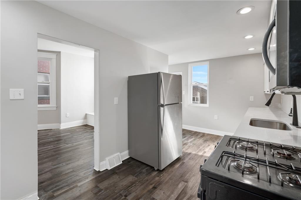 808 Bay Ridge Avenue Pittsburgh, PA 15226 - Photo 10 of 34 a kitchen with stainless steel appliances granite countertop a refrigerator and a stove