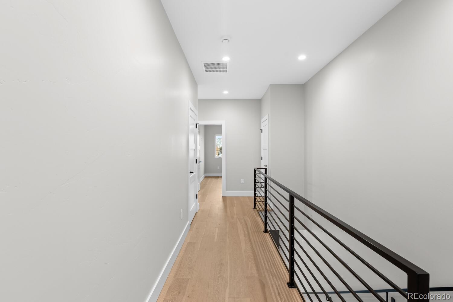 1306 Yates Street Denver, CO 80204 - Photo 16 of 29 a view of a hallway with wooden floor