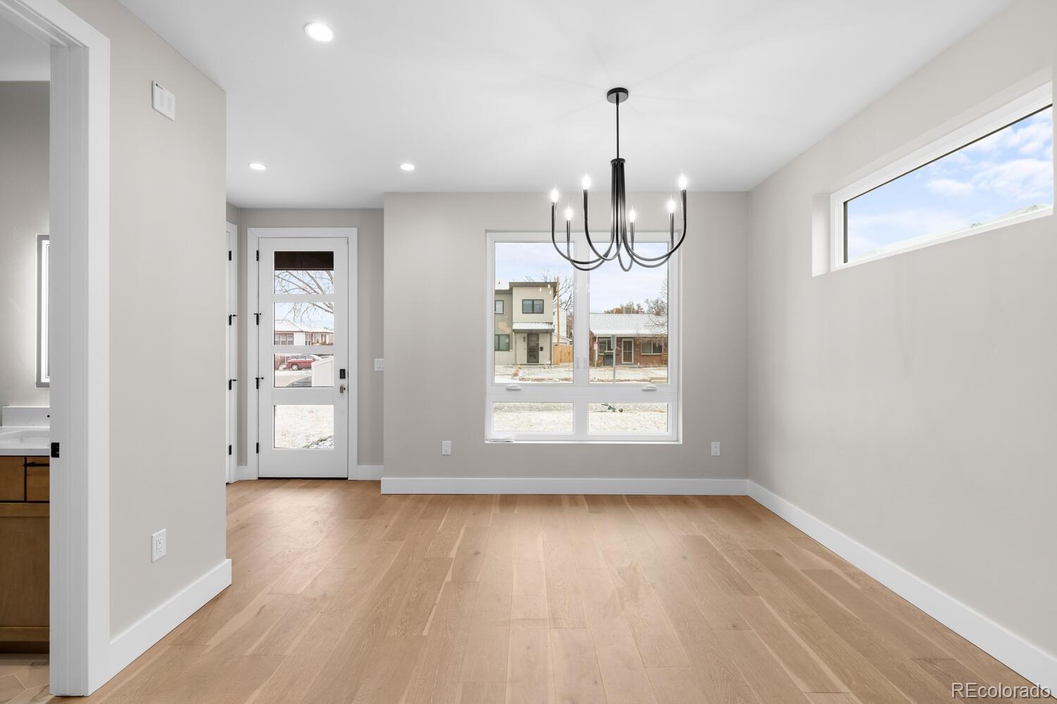 1306 Yates Street Denver, CO 80204 - Photo 6 of 29 a view of empty room with wooden floor
