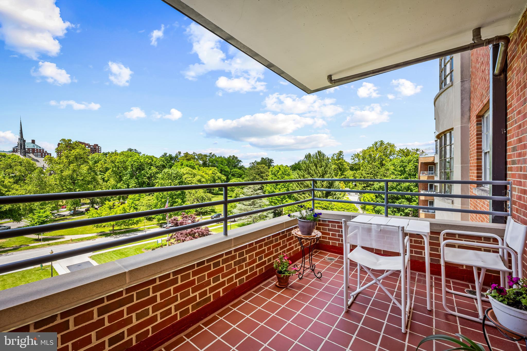 3601 Greenway, Unit 705 Baltimore, MD 21218 - Photo 23 of 30 a view of a chairs and table in the balcony
