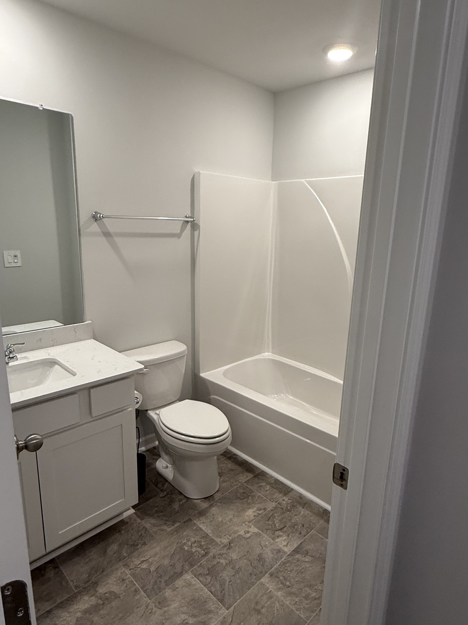 193 Mackenzie Way Lewisburg, TN 37091 - Photo 19 of 20 a bathroom with a sink a toilet and shower