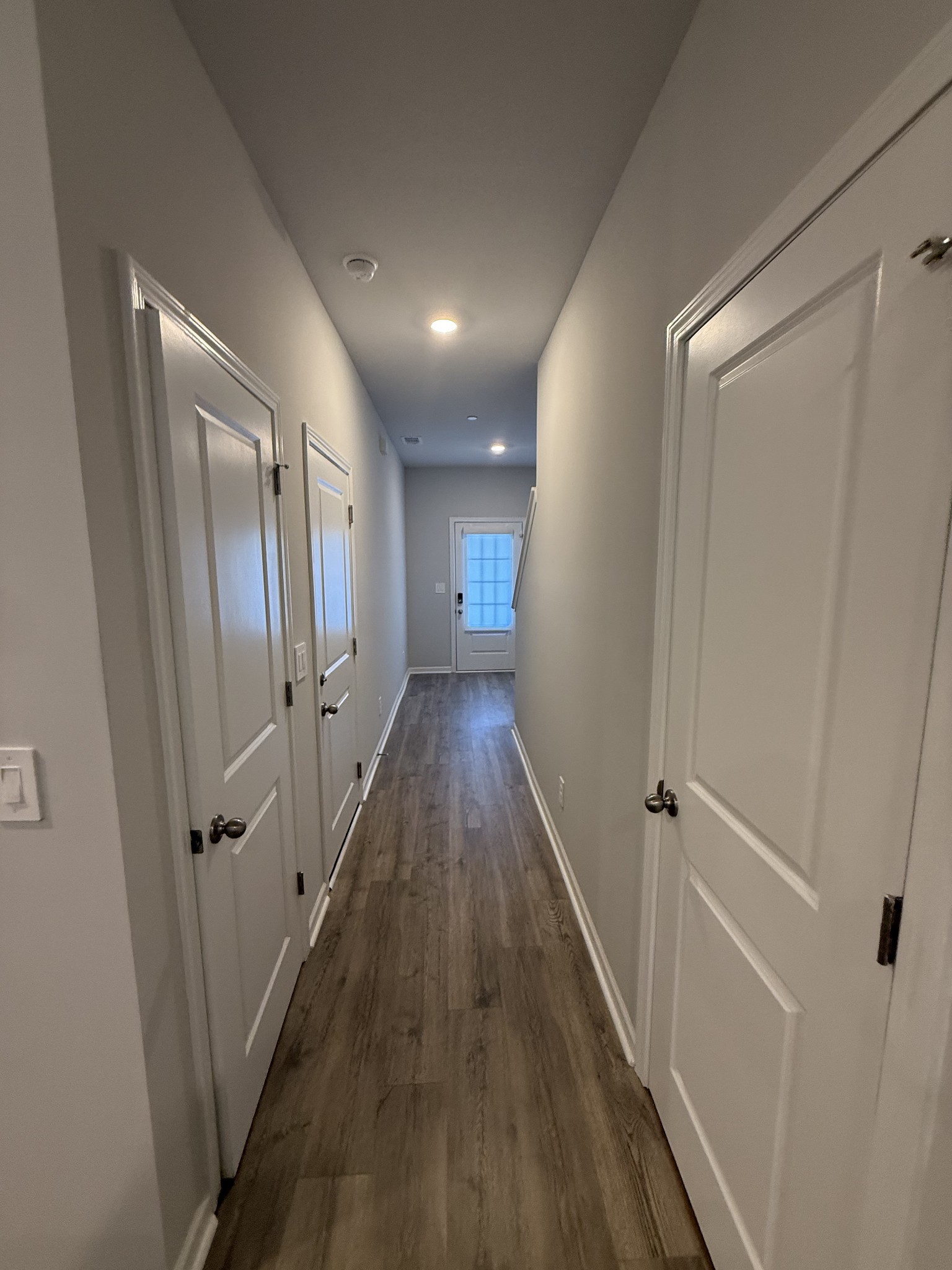 193 Mackenzie Way Lewisburg, TN 37091 - Photo 9 of 20 a view of a hallway with wooden floor and staircase