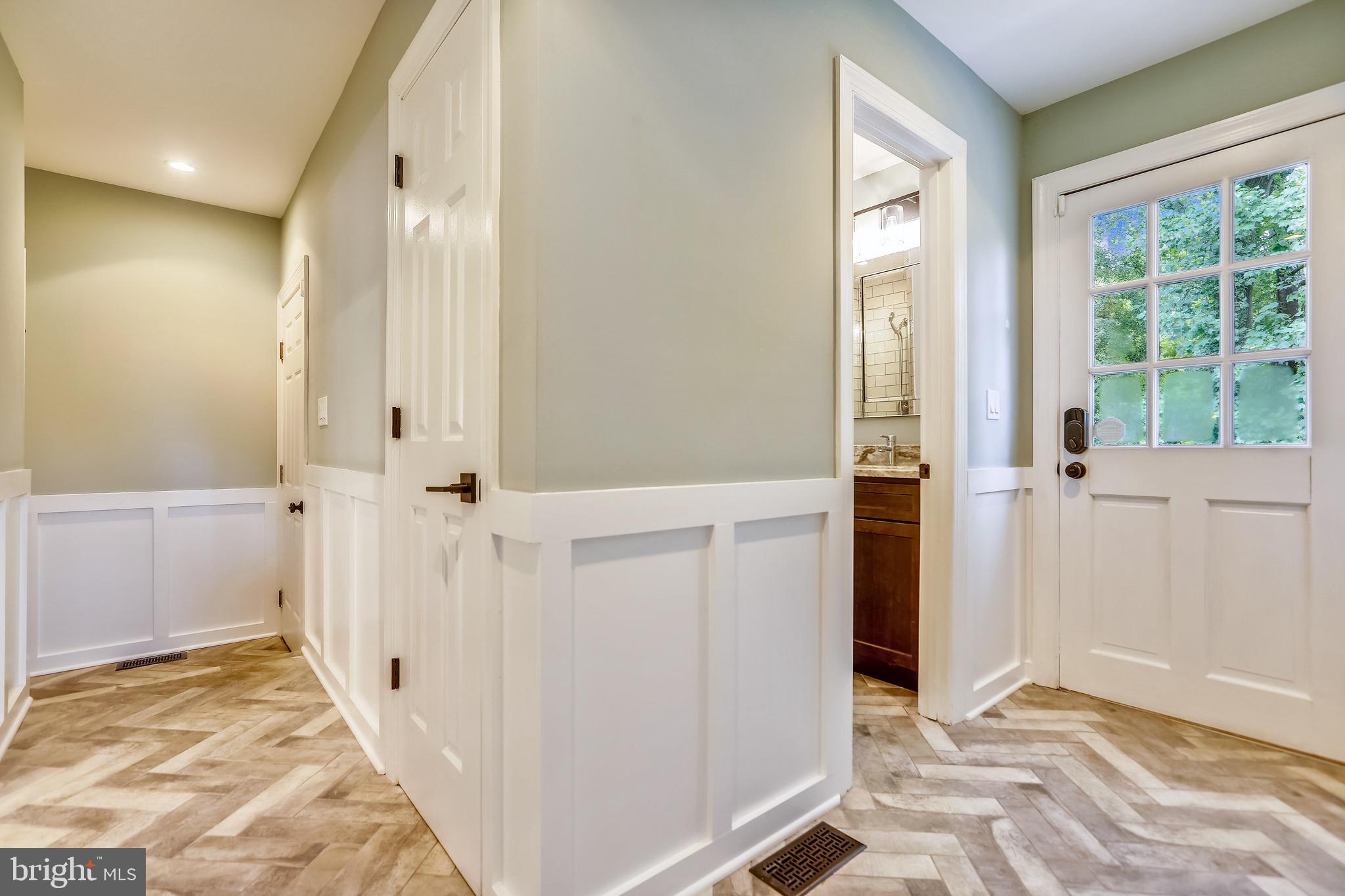 451 Ferry Point Road Annapolis, MD 21403 - Photo 47 of 64 Side entry hall to garage and full guest bathroom